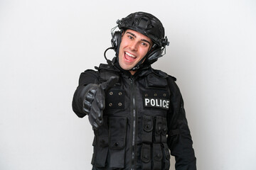 SWAT caucasian man isolated on white background shaking hands for closing a good deal