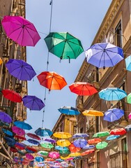 Umbrellas in a street near the Catania fish market on the island of Sicily.