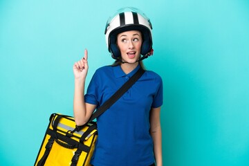 Young caucasian woman with thermal backpack isolated on white background pointing up and surprised