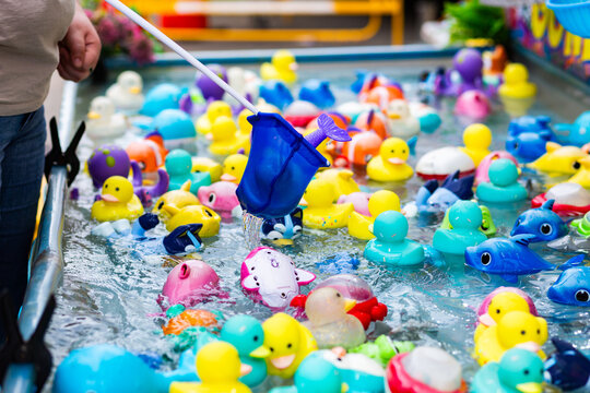 Carnival sideshow gave catching floating toy animals with net for prizes
