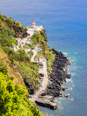 View of "Farol do Arnel" lighthouse from viewpoint "Vista dos Borcos", Azores, Portugal 