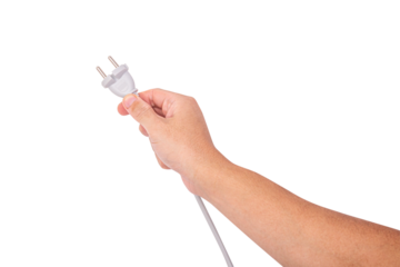 Human hand plugging electrical power cord into wall socket, isolated on white background with clipping path.