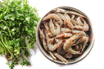 Fresh prawns in a bowl and veggies, Tasty sea food. Raw Shrimps healthy food.