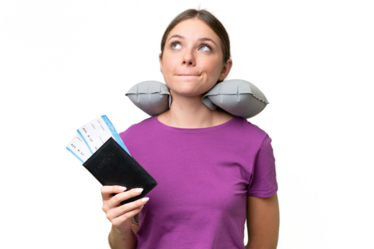 Young beautiful blonde woman with Inflatable travel Pillow over isolated background and looking up