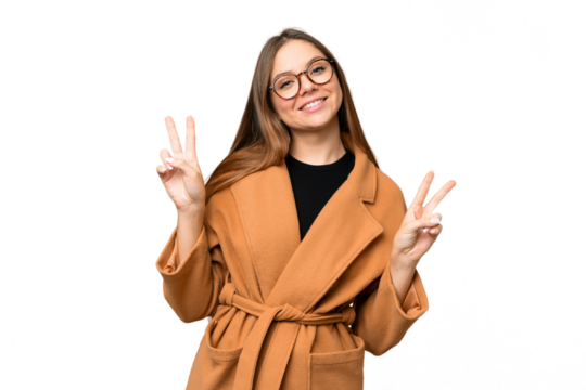 Young blonde woman over isolated chroma key background showing victory sign with both hands