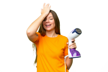 Young blonde woman holding a vertical steam iron over isolated chroma key background has realized something and intending the solution
