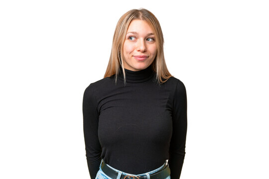 Young pretty blonde woman over isolated chroma key background making doubts gesture looking side