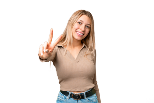 Young pretty blonde woman over isolated chroma key background smiling and showing victory sign