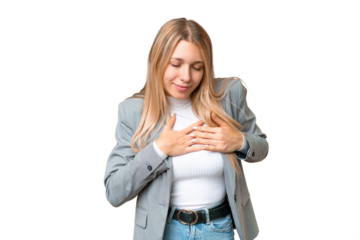 Young pretty blonde woman over isolated chroma key background having a pain in the heart