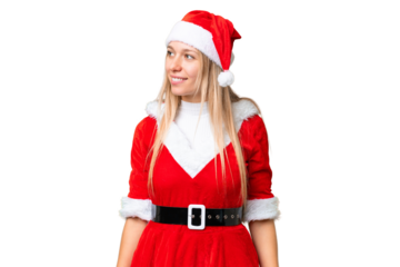 Young blonde woman with christmas hat over isolated chroma key background looking side