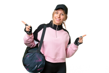 Pretty sport woman with sport bag over isolated chroma key background pointing finger to the laterals and happy