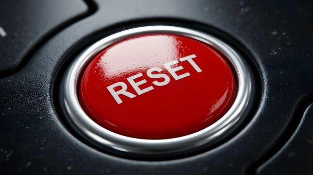 Extreme Macro Shot of Red 'RESET' Button on a Dark Control Panel