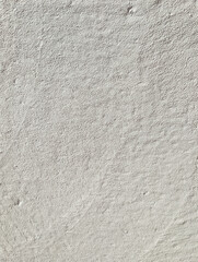Vertical White Rough Plaster Wall Texture Background featuring Grunge Stucco Surface and Grainy Cement Pattern for Abstract Design