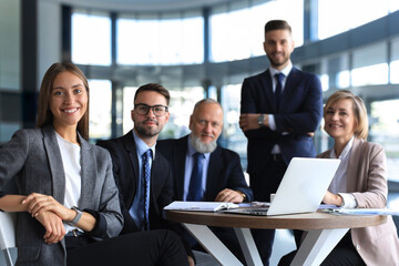 Portrait of a positive business employees at an office business meeting.
