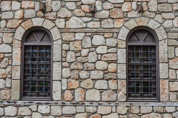 Symmetrical Arched Windows in a Stone Masonry Wall