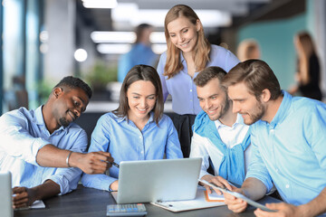 startup business team on meeting in modern bright office interior brainstorming, working on laptop and tablet computer