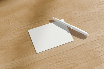Blank Postcard Mockup on Wooden Desk with Pen &ndash; Stationery Design Template