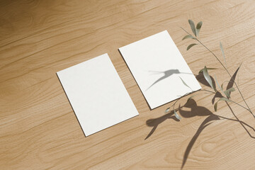 Postcard Mockup with Natural Plant Shadows on Wooden Surface &ndash; Vertical Card Template