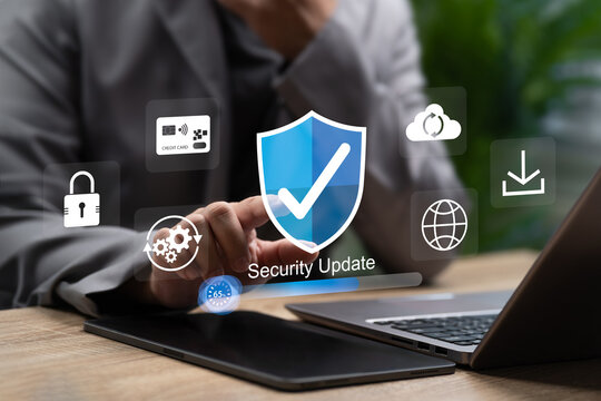 Cybersecurity System Update,Businessman Using Tablet Enhance Security Protection,Prevent Scammer Attacks, Safeguard Financial Data, Ensure Secure Downloading Through Modern Digital Security Management