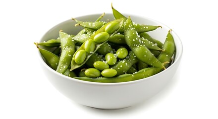 Close up of a white bowl filled with salted edamame pods and beans on a white background soybean green