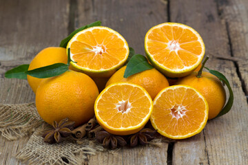 fresh tangerines on old wooden background