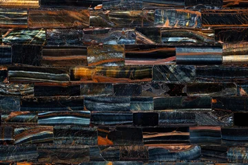 Selbstklebende Fototapeten Marmor Tiger Eye Blue slab. Semi precious dark pattern. Exclusive luxury gemstone background. Polished semiprecious stone for ceramic wall and floor digital tiles. Precious mineral quartz pattern.  © Dmytro Synelnychenko