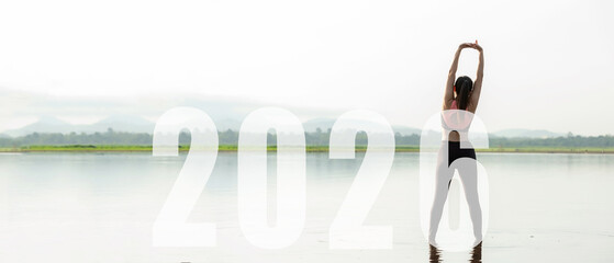 Happy new year start up 2026.  Yoga women lifestyle exercise and pose for healthy life. people balance body vital zen and meditation for workout sunrise morning nature background for success 2026