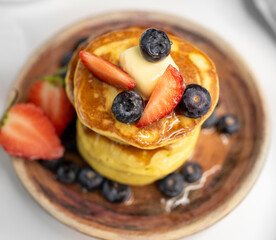 Top View Stack of Pancakes on Plate with Berries