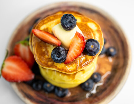 Top View Stack of Pancakes on Plate with Berries Close-up - Powered by Adobe