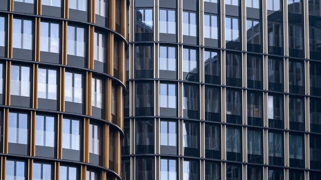 A breathtaking architectural masterpiece with a sleek and eye-catching glass exterior. High quality photo