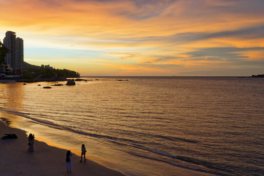Penang skyline and beach on the Malacca Straits at sunset, Penang, Malaysia