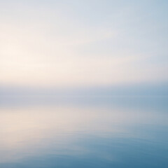 Fototapeta premium Soft morning light over a calm lake with gentle reflections