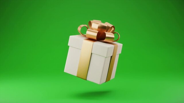 A white gift box with a golden ribbon and bow floating against a vibrant green background, ready for a celebration.