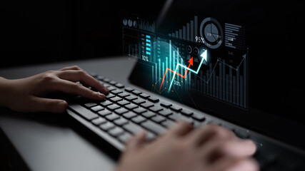 A pair of hands rests on a keyboard, surrounded by dynamic digital graphs and charts that represent data analysis and financial growth in a modern workspace. Scalp