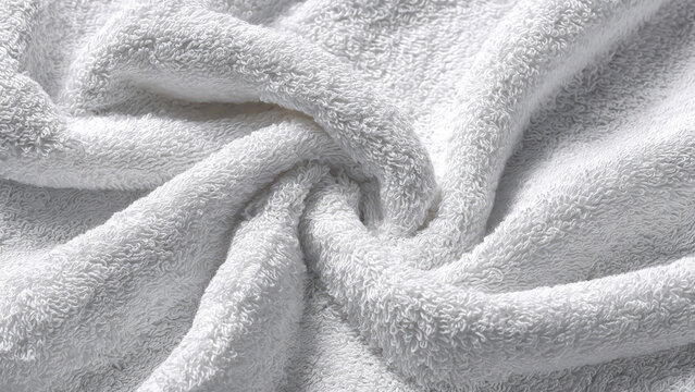 Close-up of soft, fluffy white terry cloth fabric showcasing its inviting texture. Perfect for comfort, cleanliness, and a luxurious feel.