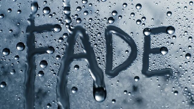Close-up of water droplets on a glass surface, creating a textured and refreshing visual effect with a blurred background