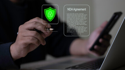 Businessman signing Digital NDA via E-signing. Secure Legal Agreement hologram with Digital Signature. Secure Contract for Paperless HR confidentiality.