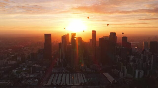 Multiple Hot Air Balloons Over Melbourne City During Sunrise