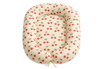 Baby lounger with a cute cherry pattern providing a cozy nest for sleeping and playtime, isolated on transparent background