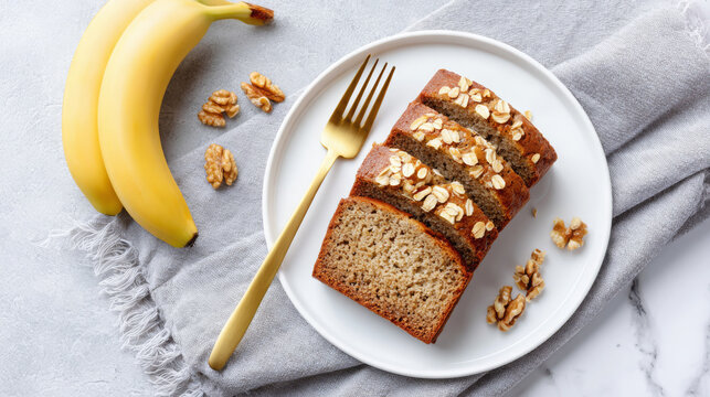 Freshly baked banana bread sliced and garnished with oats, served on a white plate with bananas and walnuts, creating a delightful and inviting culinary scene