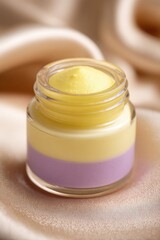 Close Up Of Multicolored Cream Pot On Light Beige Background