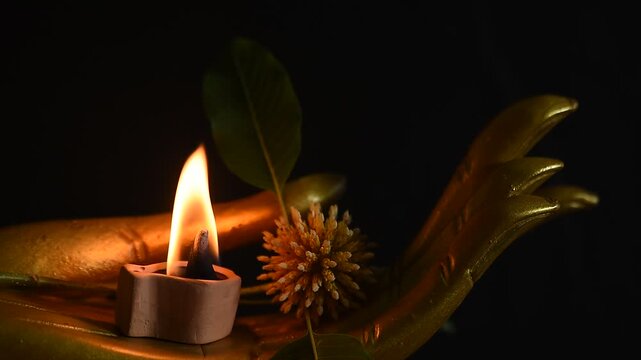 Aromatherapy with Kratom or Mitragyna speciosa Korth branch flower on black ceramic background.