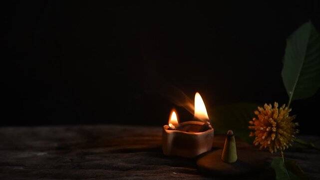 Aromatherapy with Kratom or Mitragyna speciosa Korth branch flower on black ceramic background.