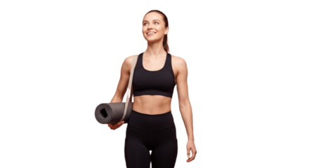 Fit smiling woman in black sports bra and leggings holding a rolled-up yoga mat over her shoulder, looking upward with a cheerful expression, active lifestyle fitness portrait on white background