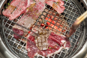 Close up juicy fresh roasted grilled meat beef sliced on charcoal grill at Japanese restaurant