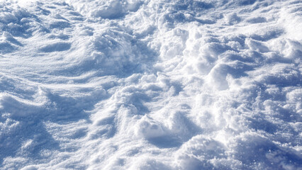 Obraz premium A beautiful close-up of fresh, textured snow reflecting sunlight, showcasing a pristine winter landscape and natural patterns.