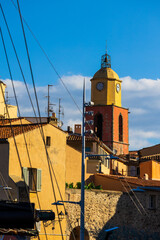 Bell tower of Notre-Dame-de-l’Assomption Church in Saint-Tropez seen from the port