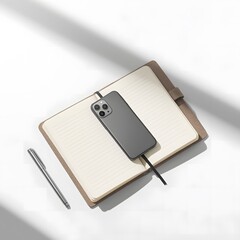 Smartphone on open notebook with pen.