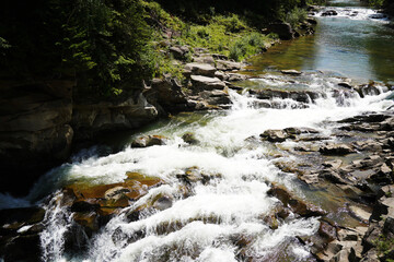 A mountain river in the forest, the water is bubbling very beautifully.