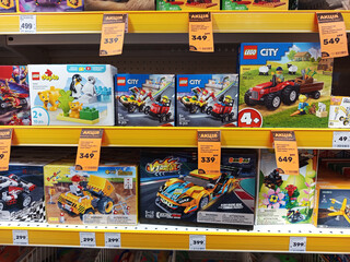 Naklejka premium Zvyagel, Ukraine - November 20, 2025: Colorful display of LEGO building sets on store shelf, featuring various themes and prices, showcasing creativity and playfulness in children's toys